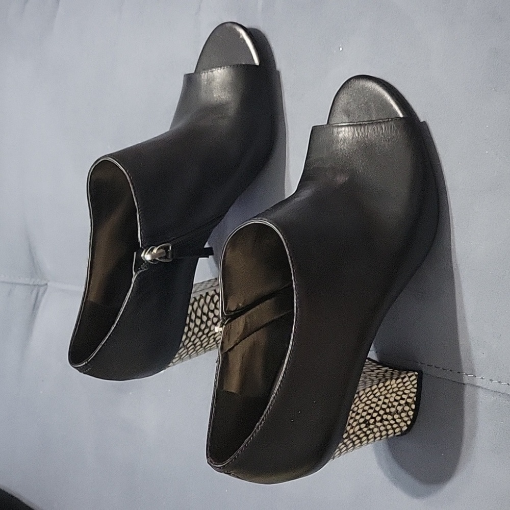 Nine West open toe booties, size 9. Side zipper, black and white heel. Used.